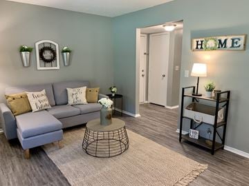Auburn apartment for rent - A living room with a grey sofa and a coffee table.