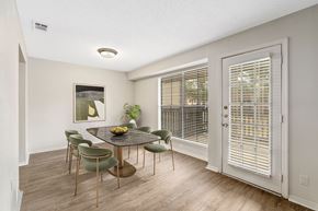 Mobile apartment for rent - Large dining area in the model with staged six seater dining table at Oakley at Hillcrest