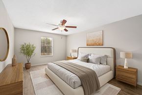 Mobile apartment for rent - Oversized primary bedroom staged with a king size bed and two nightstands and dresser at Oakley at Hillcrest in west mobile, al