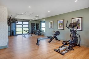Tuscumbia apartment for rent - A spacious gym with a variety of exercise equipment.