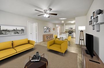 Tuscumbia apartment for rent - A living room with a yellow couch and a television.