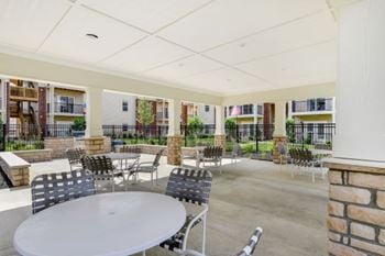 Courtyard oasis swimming pool with expansive sun deck and pavillion
