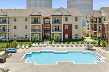 Courtyard oasis swimming pool with expansive sun deck and pavillion