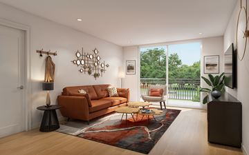 Naples apartment for rent - A living room with a brown couch and a rug.