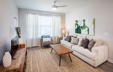 Gonzales apartment for rent - a living room with a couch and a coffee table