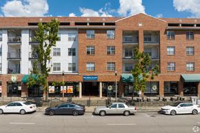 Birmingham apartment for rent - A building with a green awning and a sign that says "Waffle House" is in front of a tree.