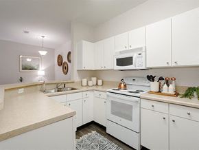 Antioch apartment for rent - a white kitchen with a stove microwave and sink