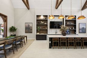 Charlotte apartment for rent - A modern kitchen with a dining table and chairs.