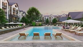 Charlotte apartment for rent - A pool surrounded by lounge chairs and umbrellas in front of apartment buildings.