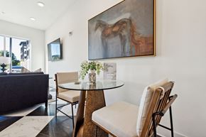 Collierville apartment for rent - a dining room with a table and chairs and a painting on the wall