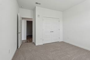 Collierville apartment for rent - an empty bedroom with a closet and a door to a hallway