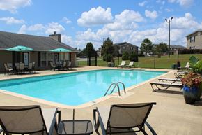 Auburn apartment for rent - Pool with sundeck, tables, and chairs at The Avery at Auburn Apartments in Auburn, AL