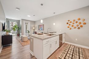 Birmingham apartment for rent - A kitchen with a white counter top and cabinets.