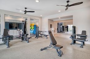 Erlanger apartment for rent - A spacious home gym with a variety of exercise equipment.