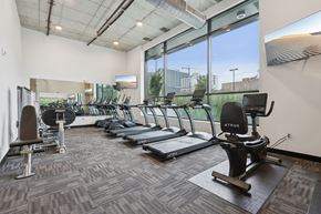 Indianapolis apartment for rent - A gym with treadmills, elliptical machines, and other exercise equipment.