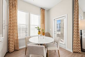 Indian Land apartment for rent - a dining room with a table and chairs and windows