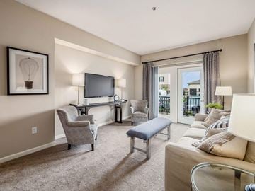 Columbus apartment for rent - a living room with a couch and chairs and a television