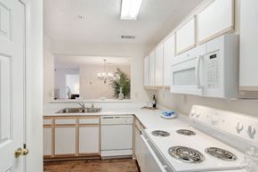 Clinton apartment for rent - a kitchen with a stove top oven next to a sink