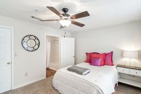 Clinton apartment for rent - a bedroom with a bed and a ceiling fan