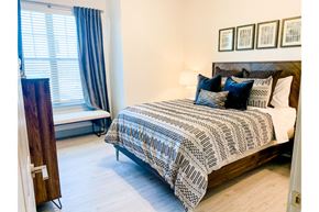 Burleson apartment for rent - a bedroom with a bed and a window