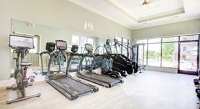 Concord apartment for rent - an image of a gym with cardio equipment on the floor