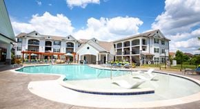 Concord apartment for rent - a large swimming pool with apartments in the background