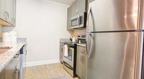 Concord apartment for rent - a kitchen with stainless steel appliances and a refrigerator