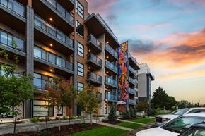 Edmonton apartment for rent - A modern apartment building with a colorful mural on the side.