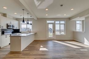 Calgary townhouse for rent - A kitchen with a counter and a microwave.
