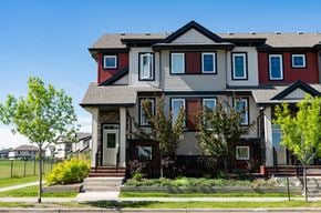 Edmonton townhouse for rent - A red and grey house with a front porch.