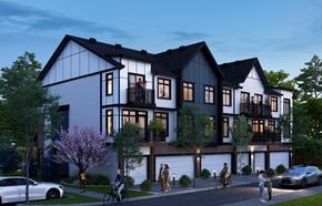 Calgary townhouse for rent - A modern house with a balcony and a garage.