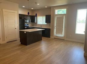 Murray townhouse for rent - an empty kitchen with an island in the middle