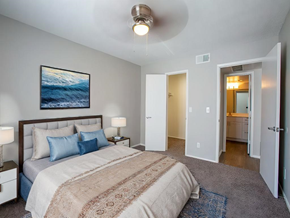Phoenix apartment for rent - A bedroom with a large bed and a painting on the wall. at Stonebridge, Arizona, 85032