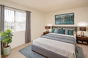 El Cajon apartment for rent - a bedroom with a bed and a large window