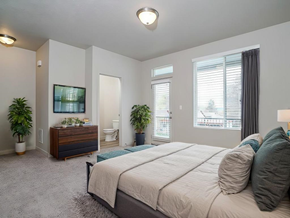 Layton apartment for rent - a bedroom with a bed and a tv in it