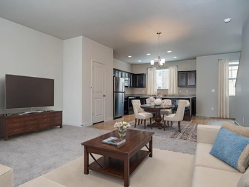 Layton apartment for rent - A living room with a white couch and a wooden coffee table.