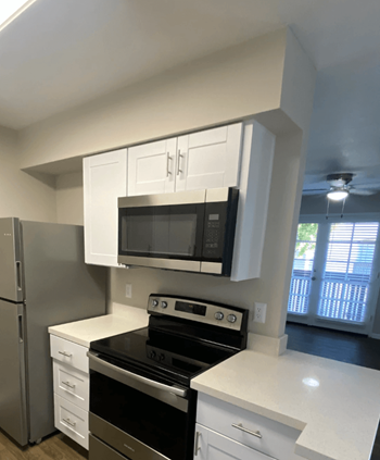 Kitchen with full sized microwave 