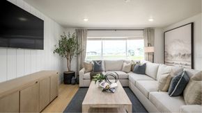 Heber City townhouse for rent - A modern living room with a large window and a white sofa.