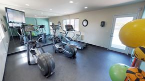 Santee apartment for rent - Stationary bikes, treadmill reflected in mirrored wall of fitness center