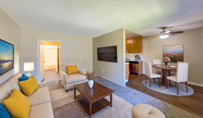 Santee apartment for rent - A living room with a couch, chairs, and a television.