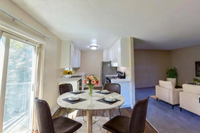 Santee apartment for rent - A dining room with a table set for two and chairs around it.