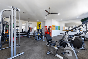 Phoenix apartment for rent - A gym with a variety of equipment including treadmills, weights, and exercise machines.