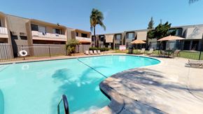 El Cajon apartment for rent - a large swimming pool with apartments in the background