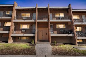 Philadelphia apartment for rent - A multi-story apartment building with a brown door and balconies.