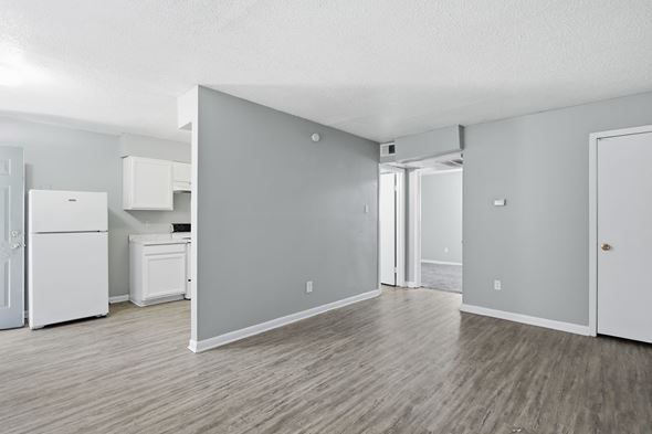 Memphis apartment for rent - A kitchen area with a white refrigerator and a grey wall.