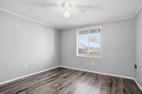 Orlando apartment for rent - A room with a window and wooden flooring.
