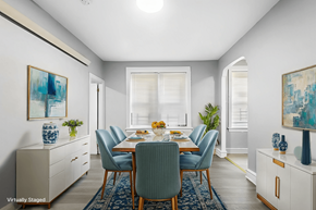 Philadelphia apartment for rent - A dining room with a table set for six and a blue rug on the floor.