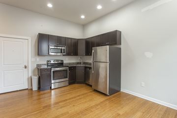 Philadelphia apartment for rent - A kitchen with stainless steel appliances and wooden floors.