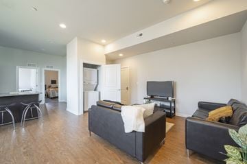 Philadelphia apartment for rent - A living room with a black couch and a television.