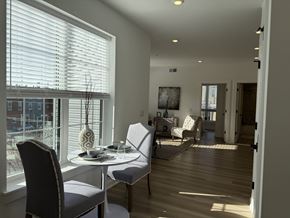 Philadelphia apartment for rent - A dining room with a table set for two and a view of the city.